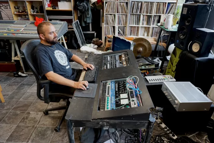 A photo of Hari at his mixing console.
