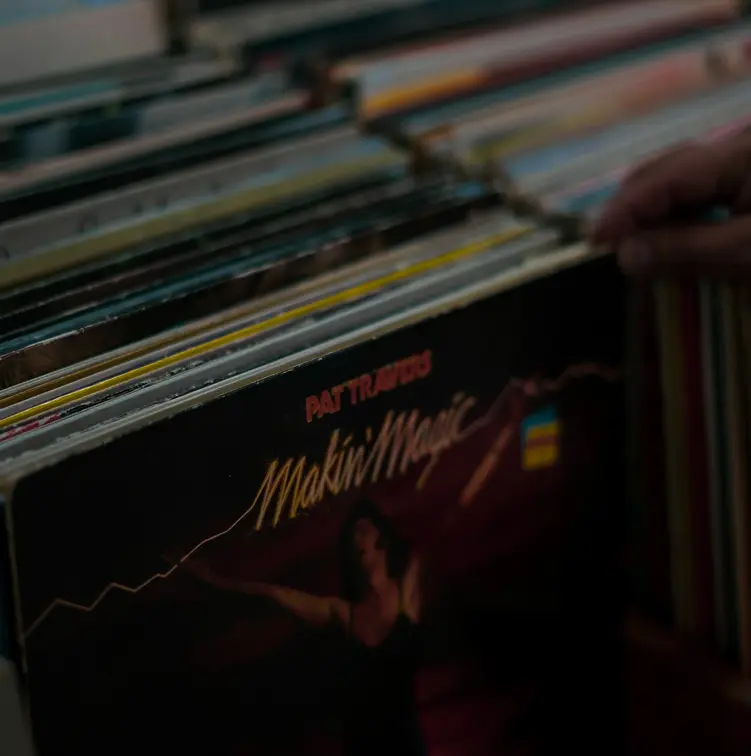 An image of someone shuffling through records in a record crate
